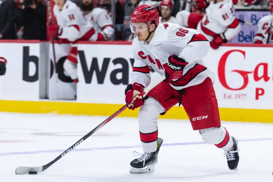 Apr 17, 2025; Ottawa, Ontario, CAN; Carolina Hurricanes center Jack Roslovic (96) skates with the puck in the second period against the Ottawa Senators at the Canadian Tire Centre. Mandatory Credit: Marc DesRosiers-Imagn Images
