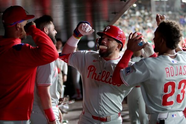 Phillies rally late, beat A’s in 11 for 9th straight win