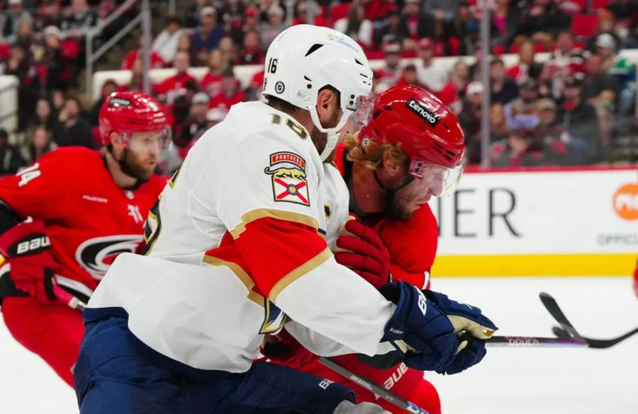 Nov 29, 2024; Raleigh, North Carolina, USA; Carolina Hurricanes center Jordan Staal (11) checks Florida Panthers center Aleksander Barkov (16) during the second period t Lenovo Center. Mandatory Credit: James Guillory-Imagn Images