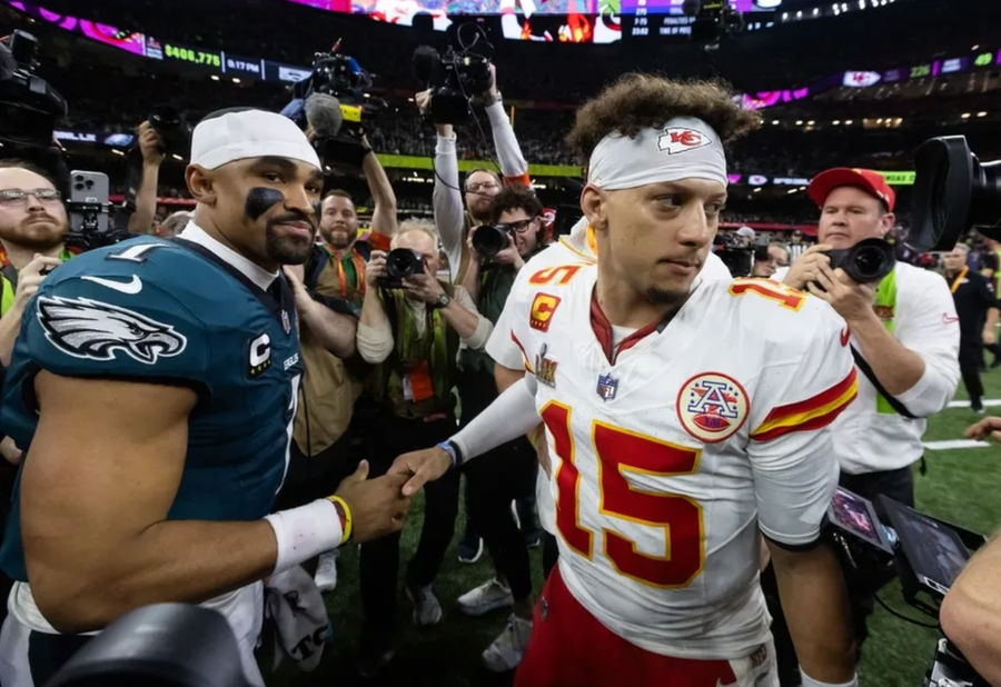Feb 9, 2025; New Orleans, LA, USA; Philadelphia Eagles quarterback Jalen Hurts (1) greets Kansas City Chiefs quarterback Patrick Mahomes (15) following Super Bowl LIX at Ceasars Superdome. Mandatory Credit: Mark J. Rebilas-Imagn Images