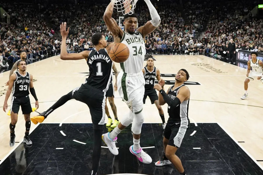 Jan 4, 2024; San Antonio, Texas, USA; Milwaukee Bucks forward Giannis Antetokounmpo (34) dunks over San Antonio Spurs forward Victor Wembanyama (1) during the first half at Frost Bank Center. Mandatory Credit: Scott Wachter-Imagn Images