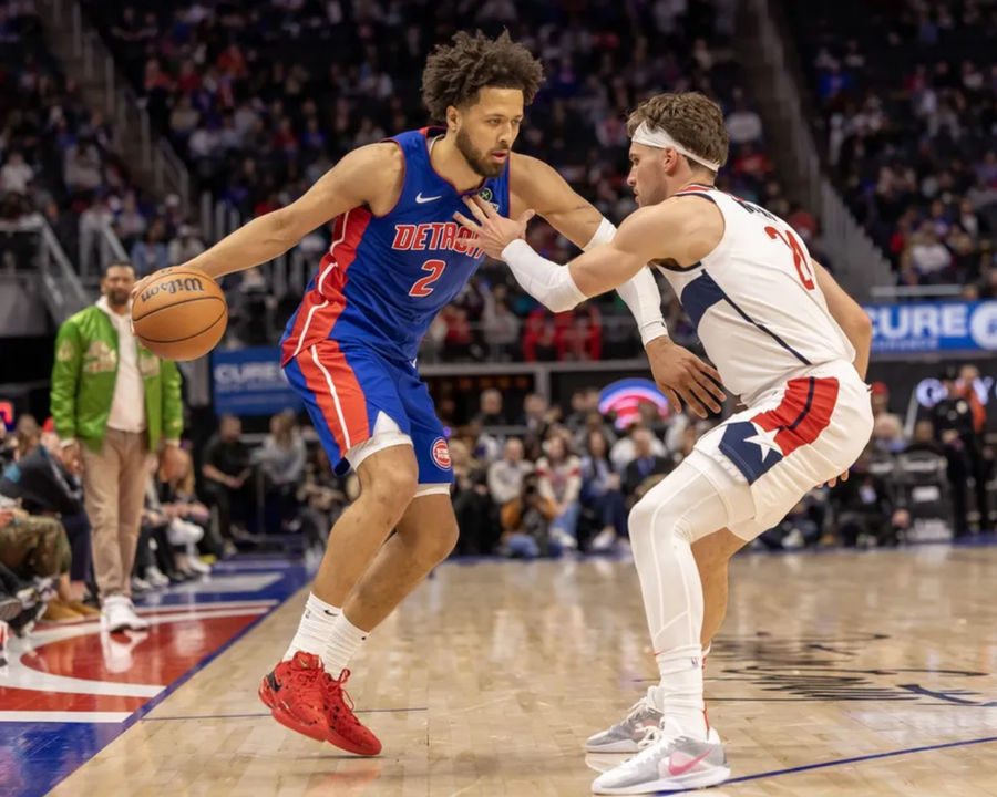 Mar 11, 2025; Detroit, Michigan, USA; Washington Wizards forward Corey Kispert (24) defends against Detroit Pistons guard Cade Cunningham (2) during the second half at Little Caesars Arena. Mandatory Credit: David Reginek-Imagn Images