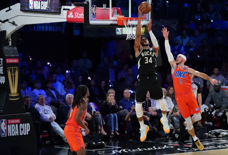 Dec 17, 2024; Las Vegas, Nevada, USA; Milwaukee Bucks forward Giannis Antetokounmpo (34) shoots against Oklahoma City Thunder guard Alex Caruso (9) during the 2nd quarter of the Emirates NBA Cup championship game at T-Mobile Arena. Mandatory Credit: Kyle Terada-Imagn Images