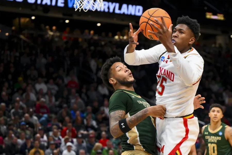 Mar 23, 2025; Seattle, WA, USA; Maryland Terrapins center Derik Queen (25) drives to the basket against Colorado State Rams forward Jaylen Crocker-Johnson (8) in the first half at Climate Pledge Arena. Mandatory Credit: Steven Bisig-Imagn Images