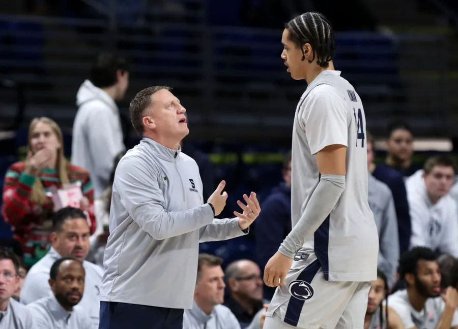 Dec 14, 2024; University Park, Pennsylvania, USA; Penn State Nittany Lions head coach Mike Rhoades talks with forward Yanic Konan Niederhauser (14) during the first half against the Coppin State Eagles at Bryce Jordan Center. Penn State won 99-51. Mandatory Credit: Matthew O'Haren-Imagn Images