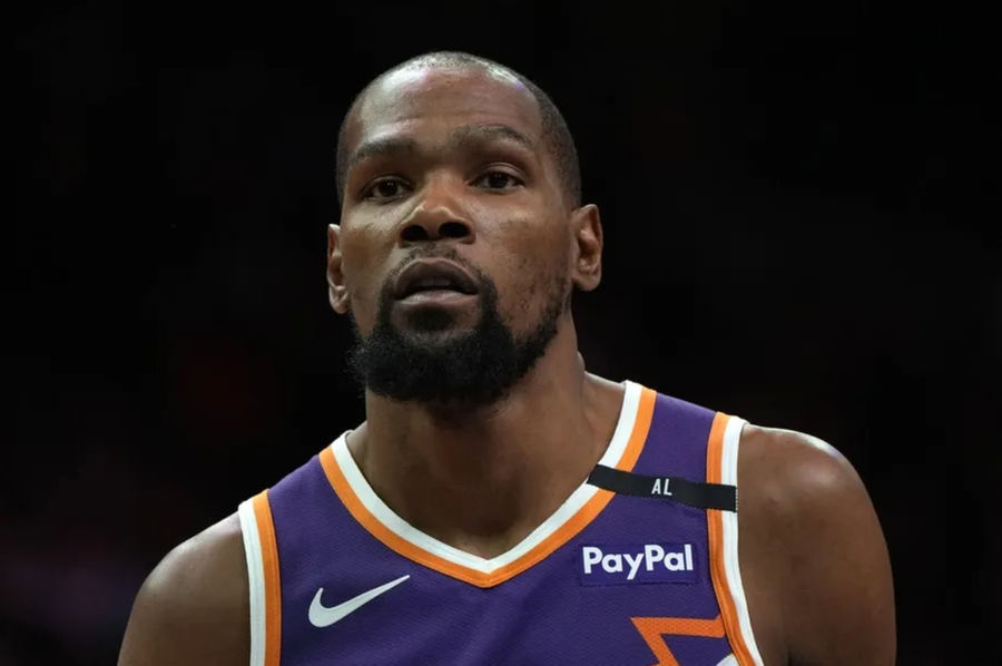 Mar 26, 2025; Phoenix, Arizona, USA; Phoenix Suns forward Kevin Durant (35) looks on against the Boston Celtics during the second half at Footprint Center. Mandatory Credit: Rick Scuteri-Imagn Images