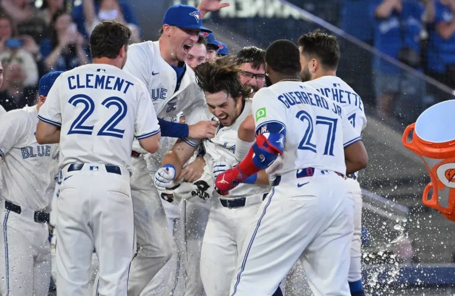Jun 17, 2025; Toronto, Ontario, CAN; Toronto Blue Jays right fielder Addison Barger (47, center) celebrates with team mates after hitting a walk off solo home run against the Arizona Diamondbacks in the ninth inning at Rogers Centre. Mandatory Credit: Dan Hamilton-Imagn Images