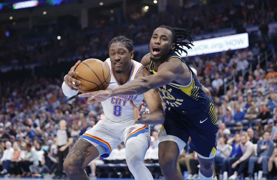 Mar 29, 2025; Oklahoma City, Oklahoma, USA; Indiana Pacers forward Aaron Nesmith (23) and Oklahoma City Thunder forward Jalen Williams (8) fight for control of the ball during the second half at Paycom Center. Mandatory Credit: Alonzo Adams-Imagn Images