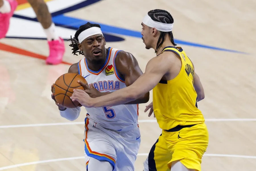 Jun 16, 2025; Oklahoma City, Oklahoma, USA; Oklahoma City Thunder guard Luguentz Dort (5) drives to the basket past Indiana Pacers guard Andrew Nembhard (2) during the second quarter in game five of the 2025 NBA Finals at Paycom Center. Mandatory Credit: Alonzo Adams-Imagn Images