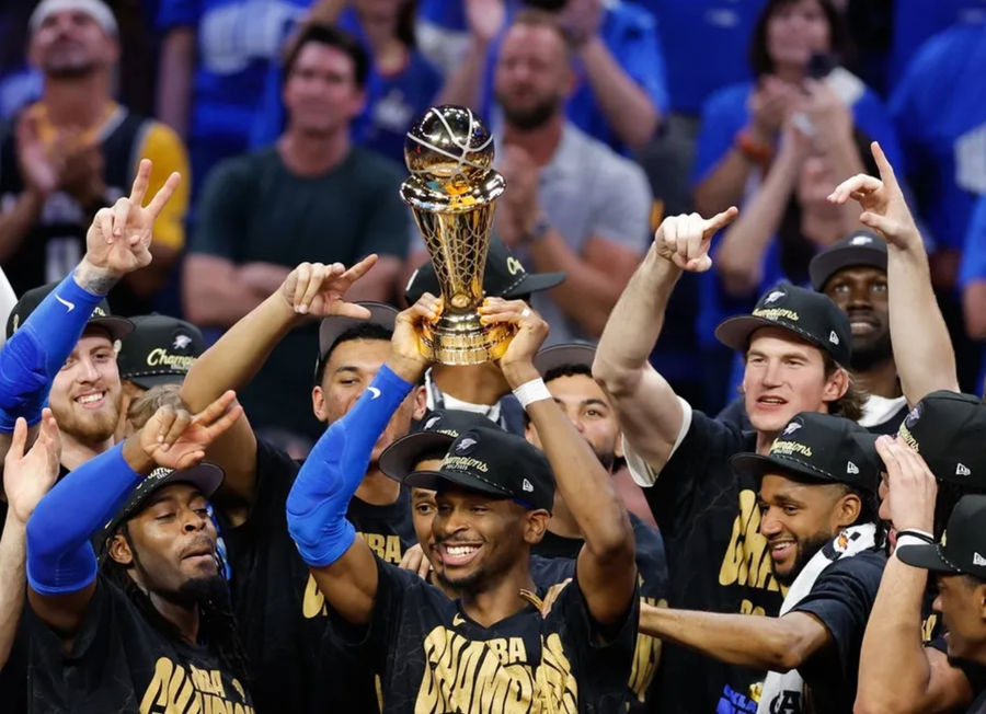 Jun 22, 2025; Oklahoma City, Oklahoma, USA; Oklahoma City Thunder guard Shai Gilgeous-Alexander (2) lifts the Larry O'Brien Championship Trophy as the Oklahoma City Thunder celebrate after winning game seven of the 2025 NBA Finals against the Indiana Pacers at Paycom Center. Mandatory Credit: Alonzo Adams-Imagn Images