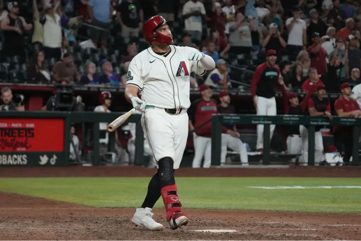 Jun 9, 2025; Phoenix, Arizona, USA; Arizona Diamondbacks first base Josh Naylor (22) hits a walk off grand slam home run against the Seattle Mariners in the eleventh inning at Chase Field. Mandatory Credit: Rick Scuteri-Imagn Images