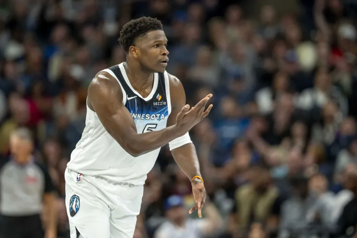 Mar 9, 2025; Minneapolis, Minnesota, USA; Minnesota Timberwolves guard Anthony Edwards (5) holds his hand up celebrating making a three point shot against the San Antonio Spurs in the first half at Target Center.