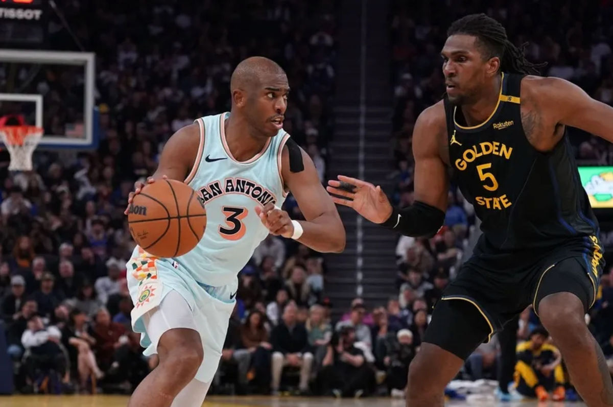 Apr 9, 2025; San Francisco, California, USA; San Antonio Spurs guard Chris Paul (3) dribbles against Golden State Warriors forward Kevon Looney (5) in the fourth quarter at Chase Center. Mandatory Credit: David Gonzales-Imagn Images