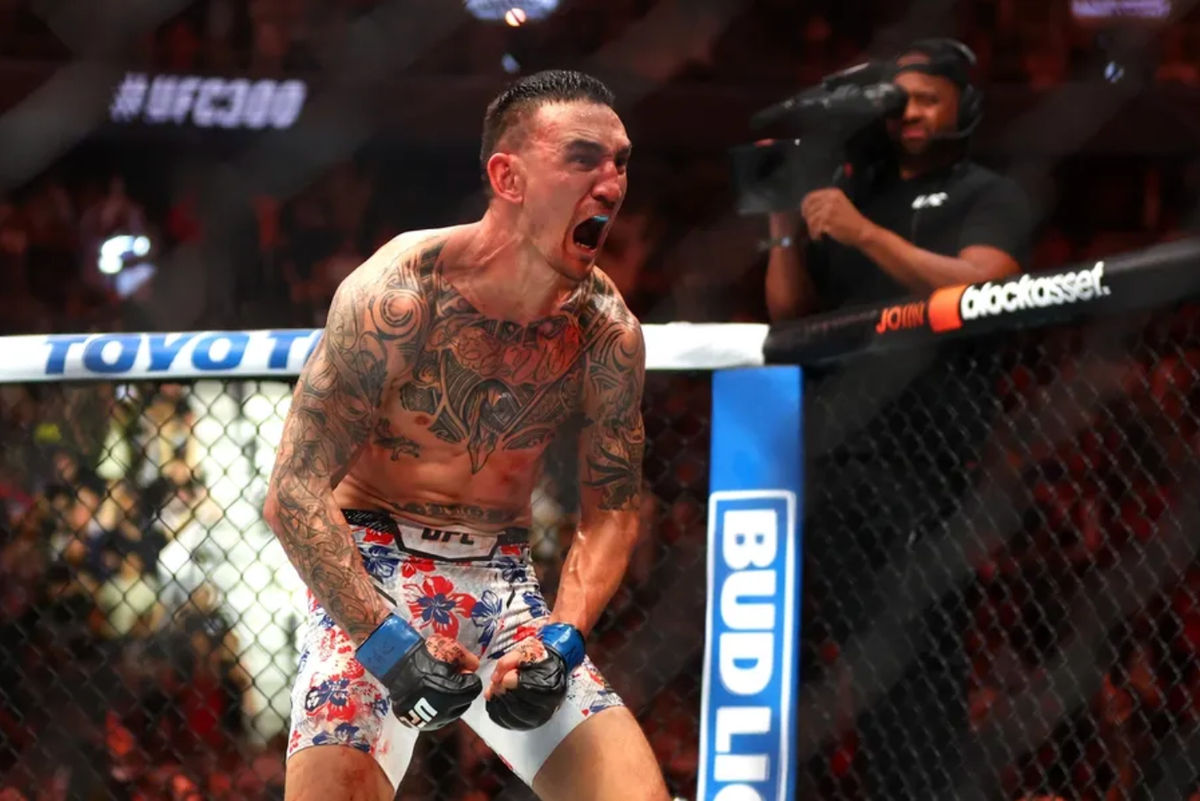 Apr 13, 2024; Las Vegas, Nevada, USA; Max Holloway (blue gloves) reacts after defeating Justin Gaethje (not pictured) during UFC 300 at T-Mobile Arena. Mandatory Credit: Mark J. Rebilas-Imagn Images