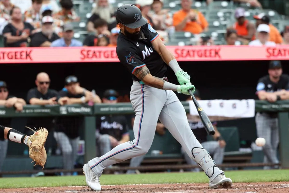 Jul 12, 2025; Baltimore, Maryland, USA; Miami Marlins outfielder Derek Hill (3) hits an RBI single during the seventh inning against the Baltimore Orioles at Oriole Park at Camden Yards. Mandatory Credit: Daniel Kucin Jr.-Imagn Images