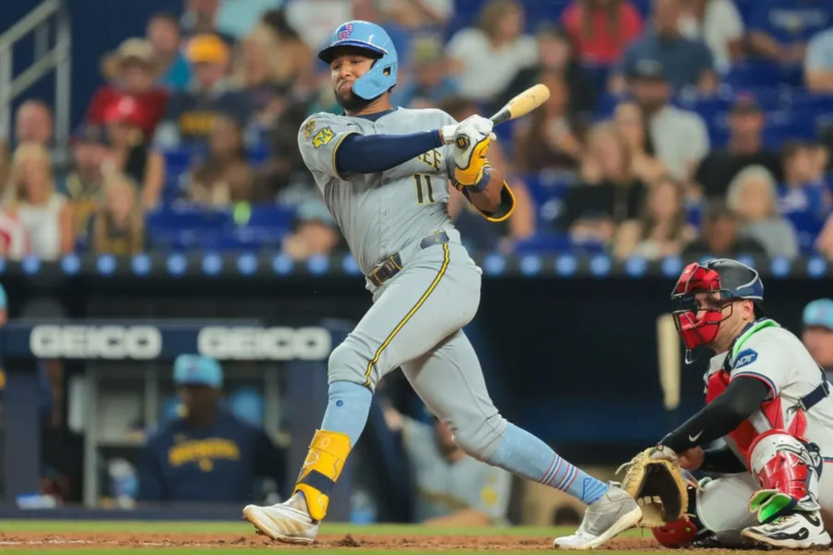 Jul 4, 2025; Miami, Florida, USA; Milwaukee Brewers center fielder Jackson Chourio (11) hits an RBI double against the Miami Marlins during the eighth inning at loanDepot Park. Mandatory Credit: Sam Navarro-Imagn Images