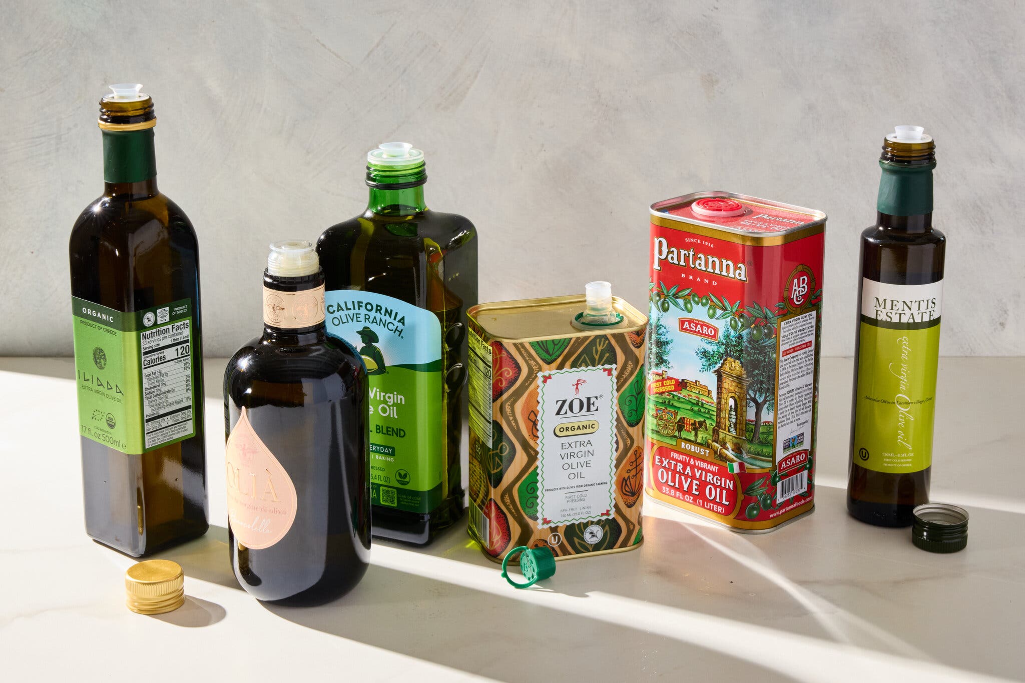 A side image of various olive oil bottles.