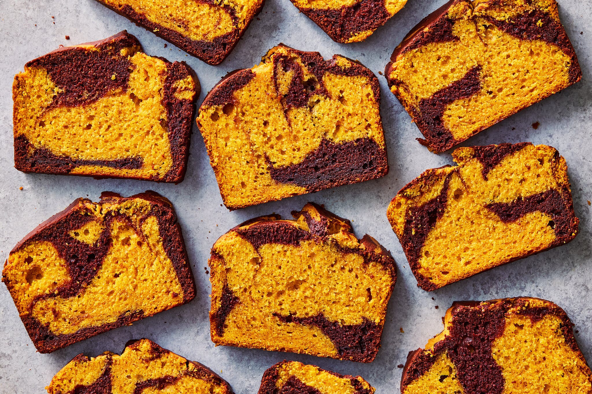 An overhead image of slices of pumpkin marble loaf cake.