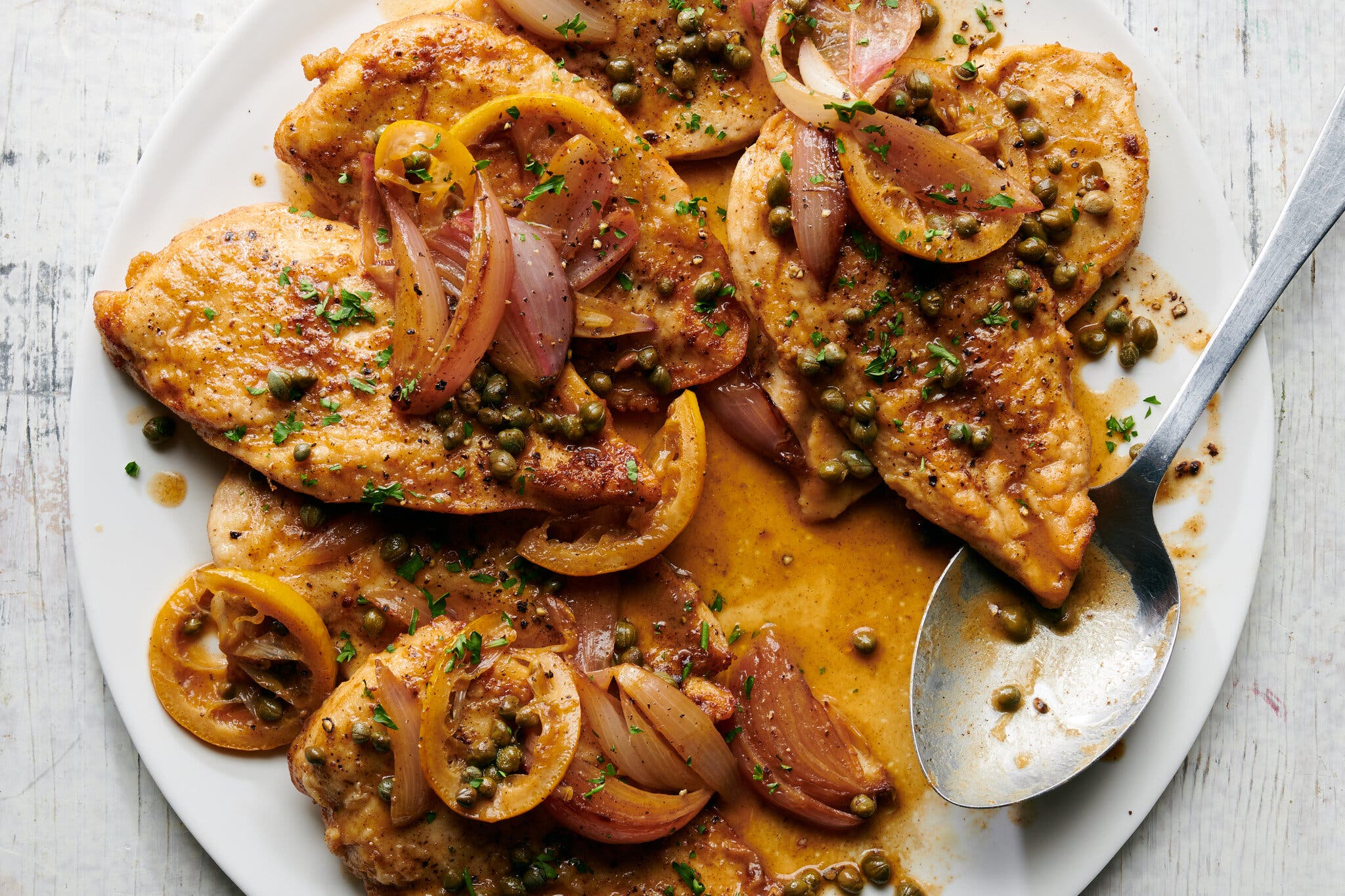 An overhead image of a chicken piccata.