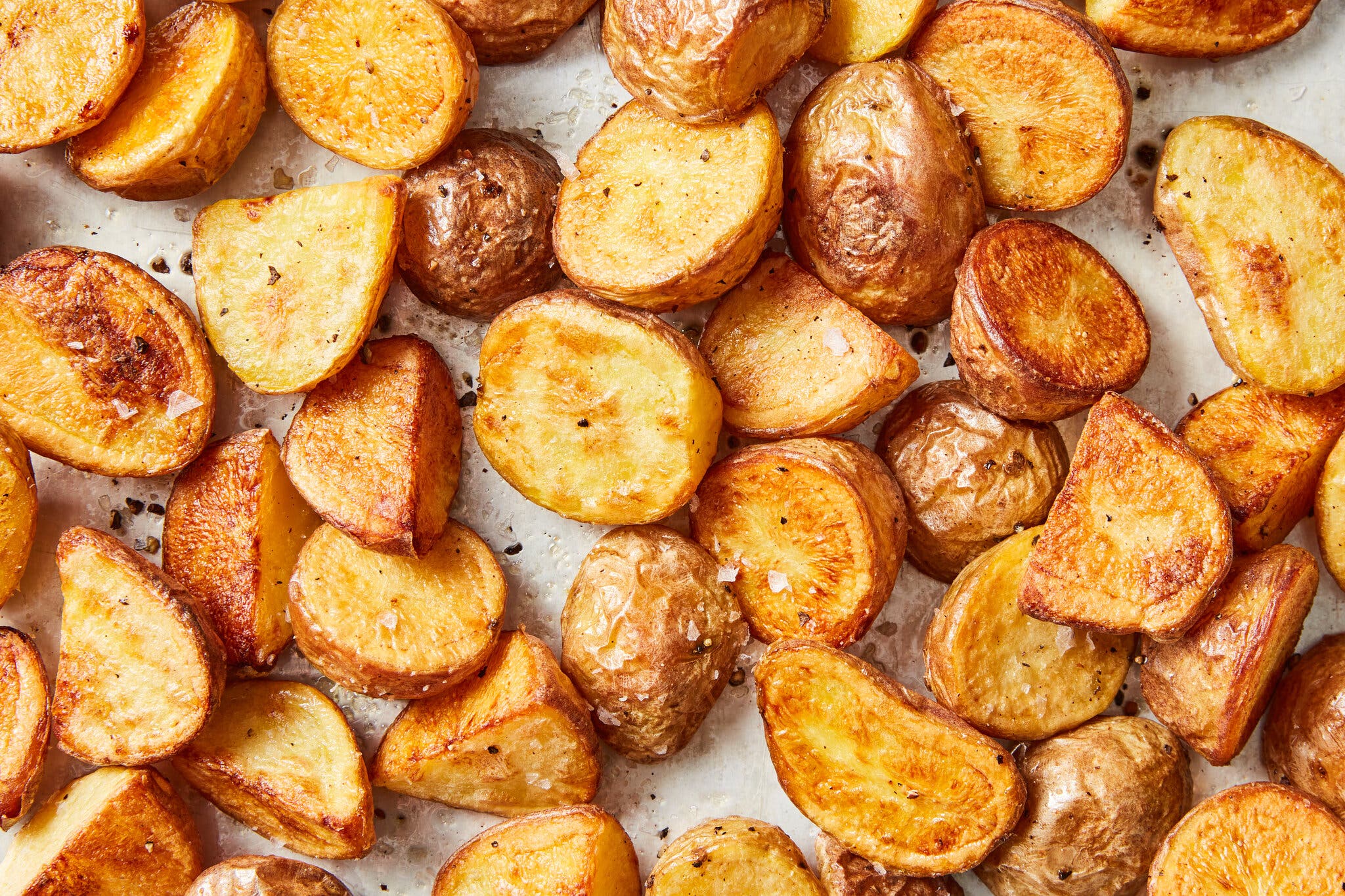 A close-up image of roasted potatoes. 