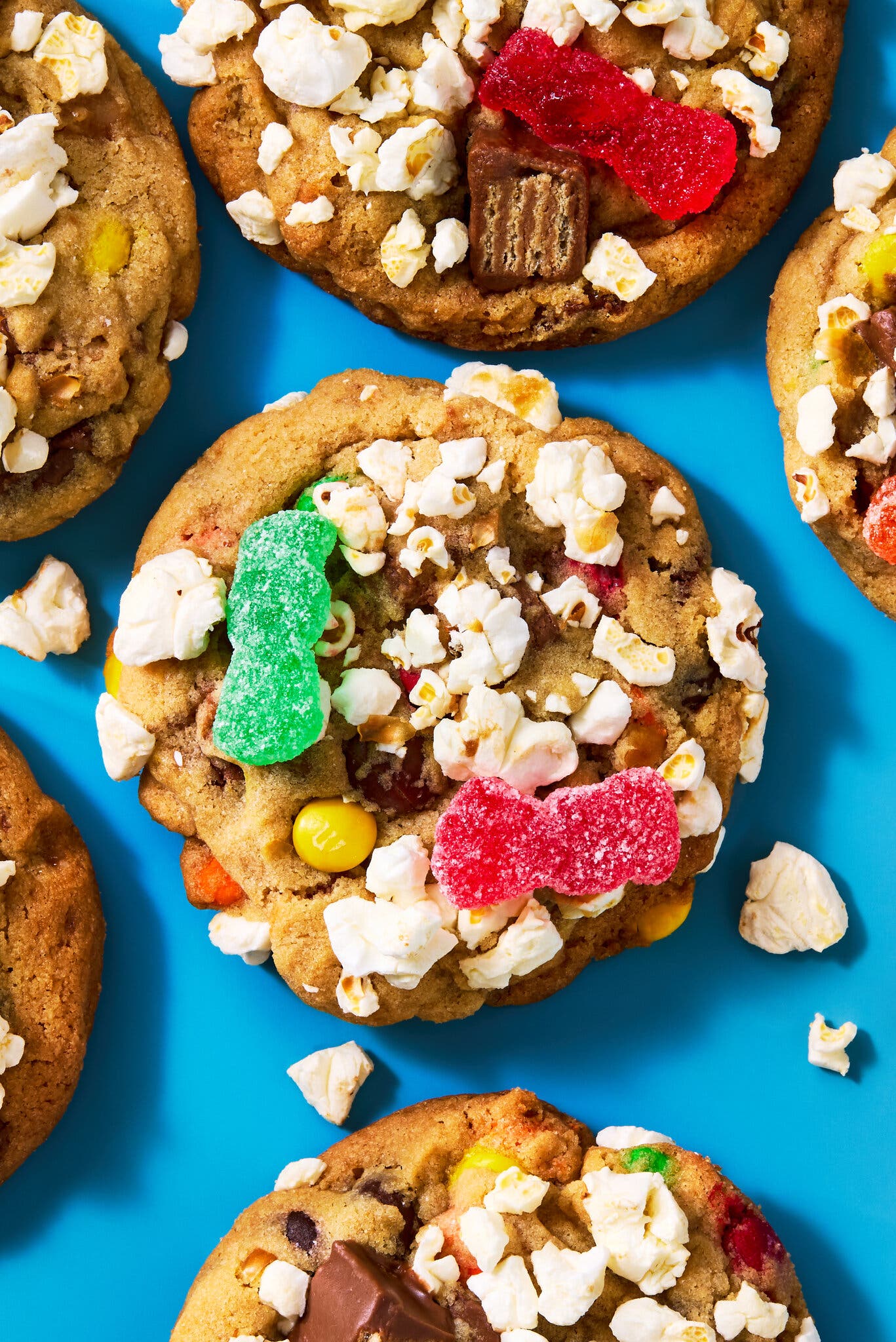 An overhead image of about a half-dozen cookies topped with candy and popcorn.