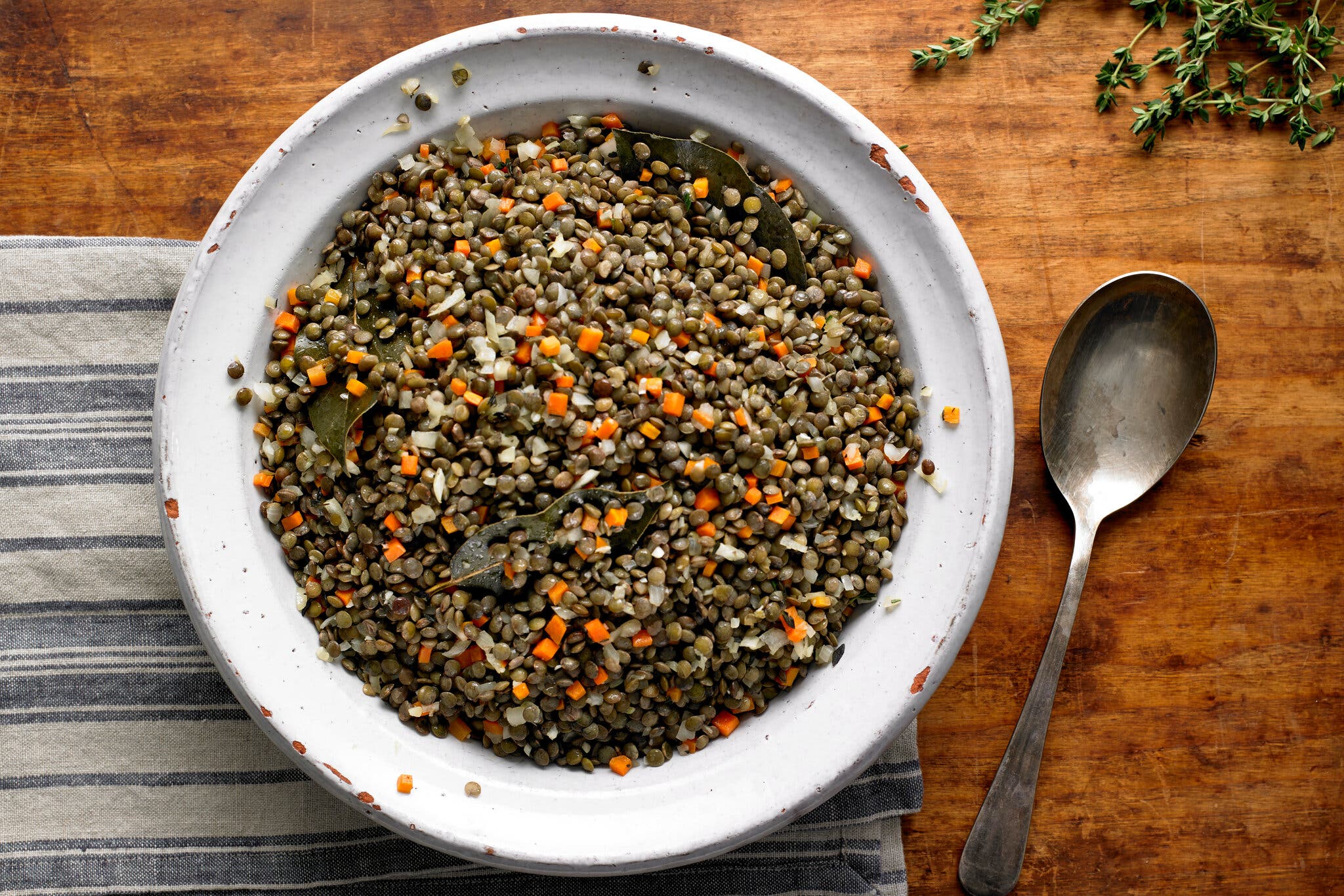 An overhead image of a bowl filled with lentils.