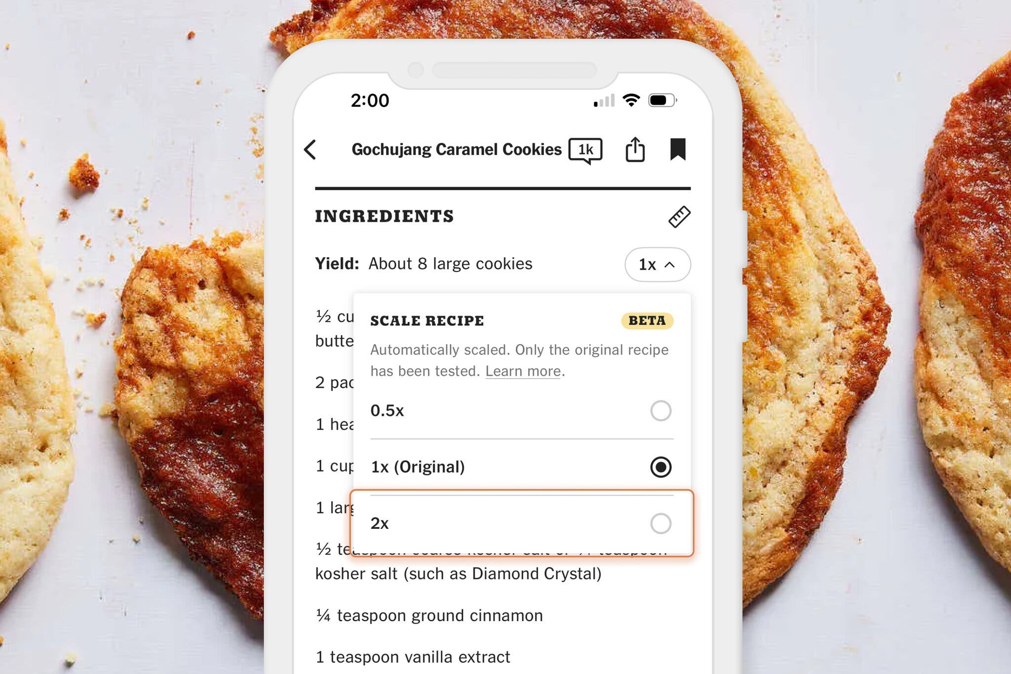 A screenshot of a recipe on an app against a background of cookies.